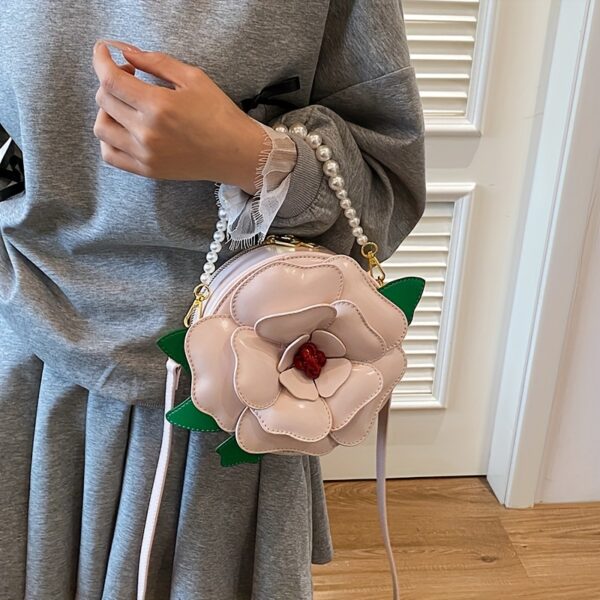 Camellia Blossom Floral Shoulder Bag from Newness, featuring a unique floral design, pearl accents, and an adjustable strap.