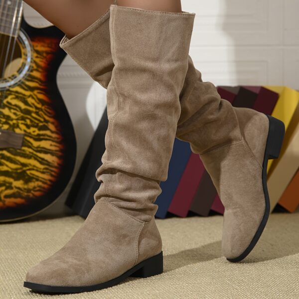 Newness Slouchy Suede Mid-Calf Boots in rich brown suede leather, showcasing the comfortable slouchy fit and mid-calf height. Perfect for adding a touch of effortless chic to any winter outfit.