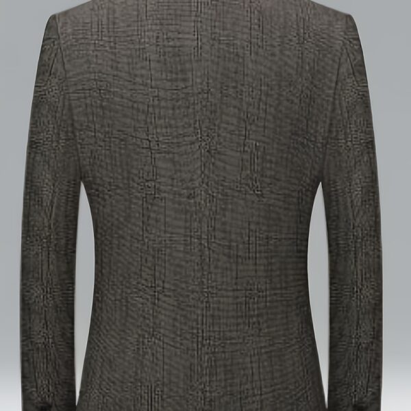 The Newness Metropolitan Slim Fit Blazer in navy blue, shown on a male model. The blazer is a slim fit and features notched lapels, button closure, and welt pockets. The model is wearing a crisp white shirt underneath. The image showcases the versatility of the blazer, suitable for both smart casual and business attire.