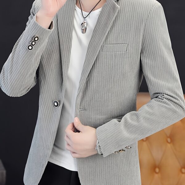 The Cairo Men's Corduroy Blazer in deep brown, a sophisticated and stylish men's blazer made from premium corduroy, perfect for any occasion. Model wearing the blazer.