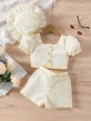 Adorable baby girl wearing a Summer Bloom floral outfit perfect for summer The outfit features a delightful floral pattern