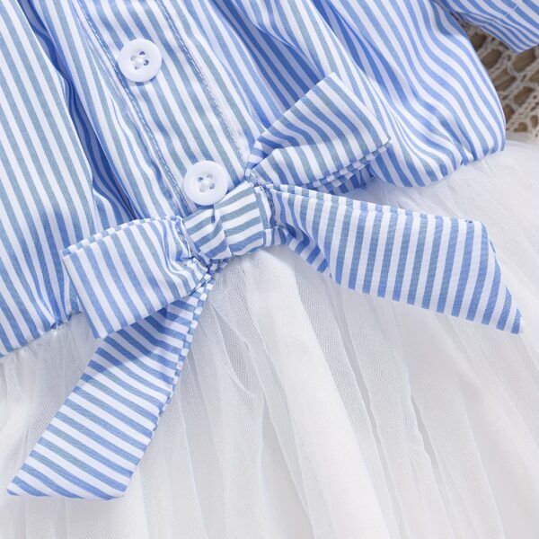 Adorable baby girl wearing a cute and playful summer stripe sundress, perfect for playtime.