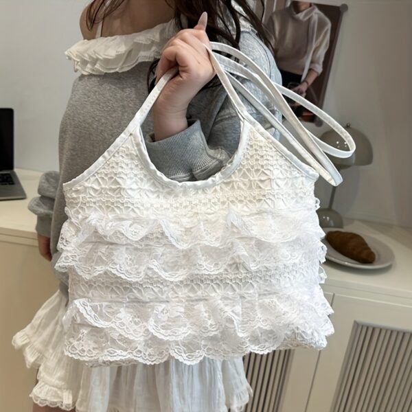 Newness Casablanca Lace Tote Bag: A stunning white lace tote bag, perfect for everyday use or travel. Showcases intricate lace detailing and roomy interior.