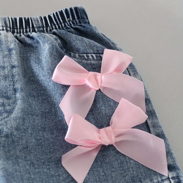 Adorable girls denim set with a cute bowknot, perfect for spring, summer, or fall. Shop Newness for stylish kids' fashion.