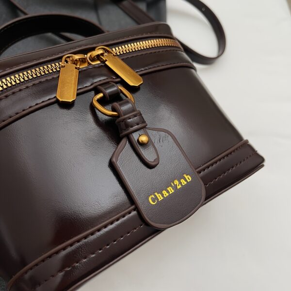 The Newness Riviera Vintage Boxy Tote, a chic and stylish boxy handbag perfect for any occasion. View the bag's structured shape, vintage-inspired details, and high-quality materials.