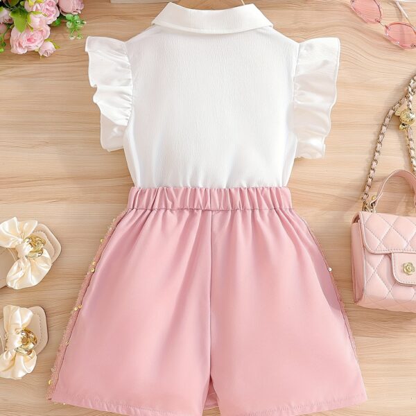 Adorable girls' summer outfit! Newness's Summer Sparkle two-piece set features a stylish top and coordinating bottom, perfect for parties, weddings, or any special occasion.