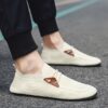 Light beige mens mesh slip on loafers with brown accents showcasing breathable mesh upper and durable rubber sole