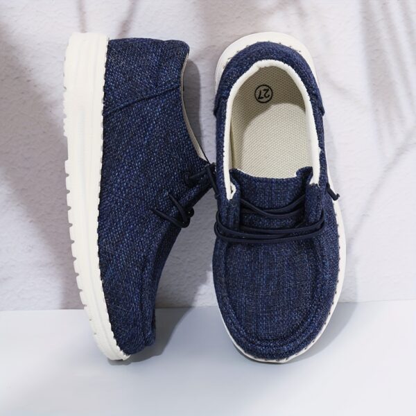 Stylish and comfortable Coastal Breeze boys canvas sneakers in blue, perfect for everyday adventures. The sneakers feature a classic design with comfortable canvas material.