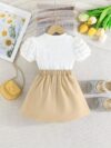 Adorable Pastel Dream Girls Summer Set featuring a pastel colored top and bottom perfect for summer The outfit is shown on a young girl highlighting its comfortable and stylish design