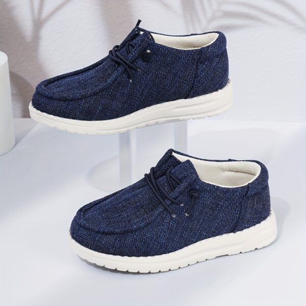 Stylish and comfortable Coastal Breeze boys canvas sneakers in blue, perfect for everyday adventures. The sneakers feature a classic design with comfortable canvas material.