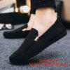Newness Metropolitan Mens Slip On Loafers in classic black featuring breathable fabric a durable PU sole and stylish golden accents Perfect for everyday wear