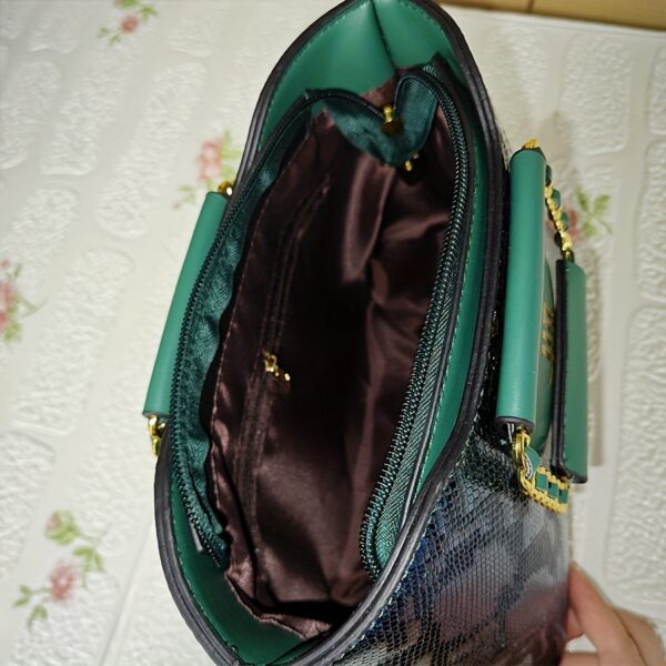 Emerald Envy Snakeskin Crossbody Bag by Newness. A chic, modern, and luxuriously designed crossbody bag in emerald green snakeskin.