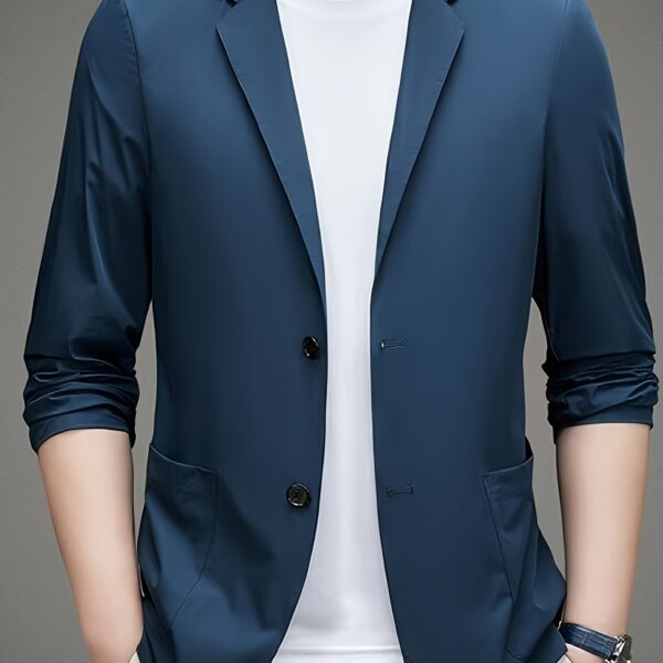 A man wearing the Newness Lightweight Breeze Men's Summer Blazer, looking effortlessly stylish in a summer setting.