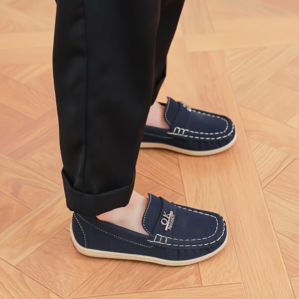 Stylish and comfortable Newness Classic Boys' Loafers, perfect for any occasion. A close-up shot showcasing the loafers' design and quality.