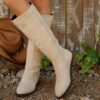 Newness Effortless Chic Winter Mid Calf Boots Stylish brown leather boots that reach mid calf perfect for any occasion The boots are shown from the side highlighting their sleek design and comfortable fit