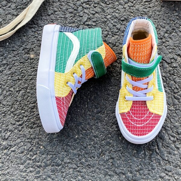 Newness Rainbow Retro Canvas Sneakers: Stylish and comfortable kids' sneakers, perfect for spring and fall. Lightweight and breathable canvas design in a vibrant rainbow color scheme.
