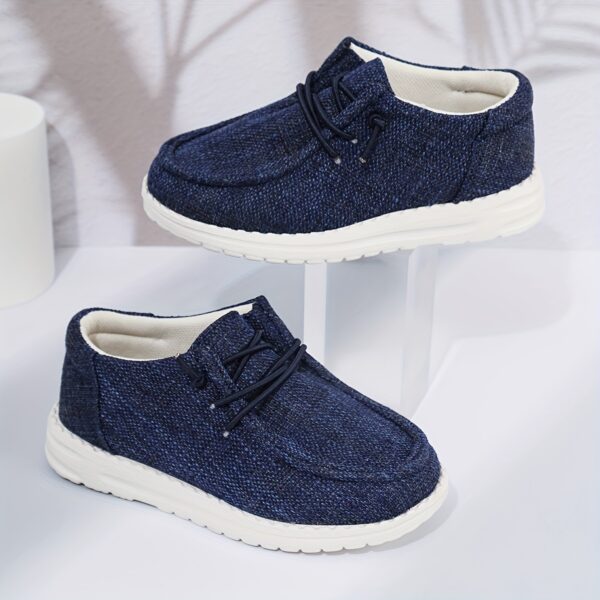 Stylish and comfortable Coastal Breeze boys canvas sneakers in blue, perfect for everyday adventures. The sneakers feature a classic design with comfortable canvas material.