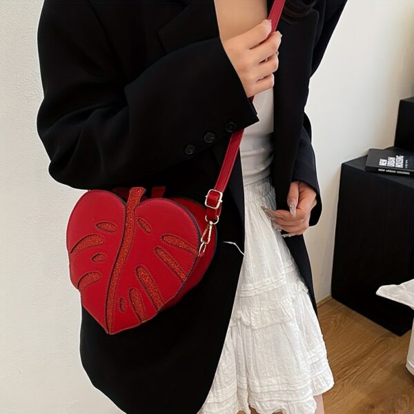 Newness Tropical Escape Leaf Crossbody Bag: A stylish and unique crossbody bag perfect for everyday use or outdoor adventures. Features a leaf-shaped design and adjustable strap.