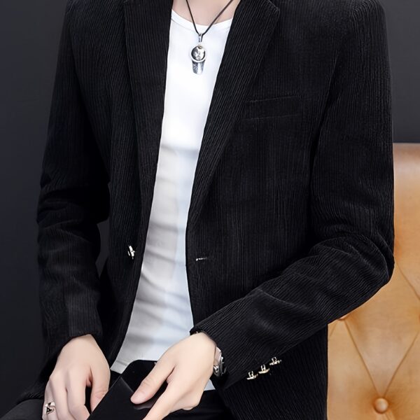 The Cairo Men's Corduroy Blazer in deep brown, a sophisticated and stylish men's blazer made from premium corduroy, perfect for any occasion. Model wearing the blazer.