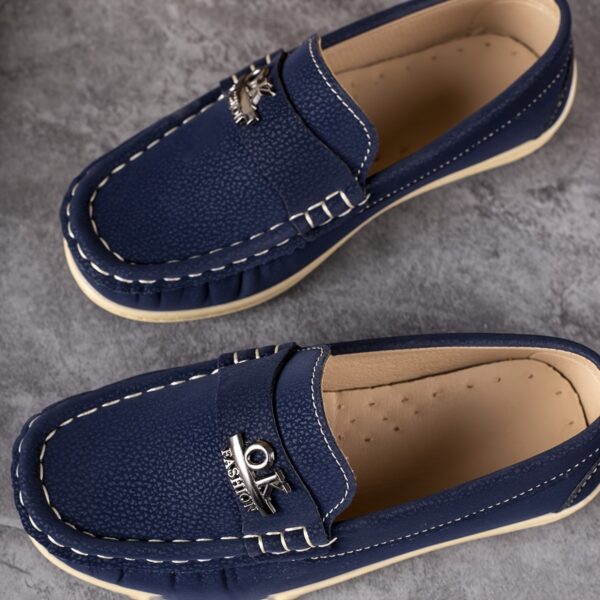 Stylish and comfortable Newness Classic Boys' Loafers, perfect for any occasion. A close-up shot showcasing the loafers' design and quality.