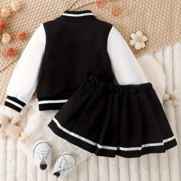 Stylish girls' preppy patchwork baseball jacket and skirt set, perfect for fall and winter. Features a mix of colorful patches on a comfortable jacket and matching skirt.