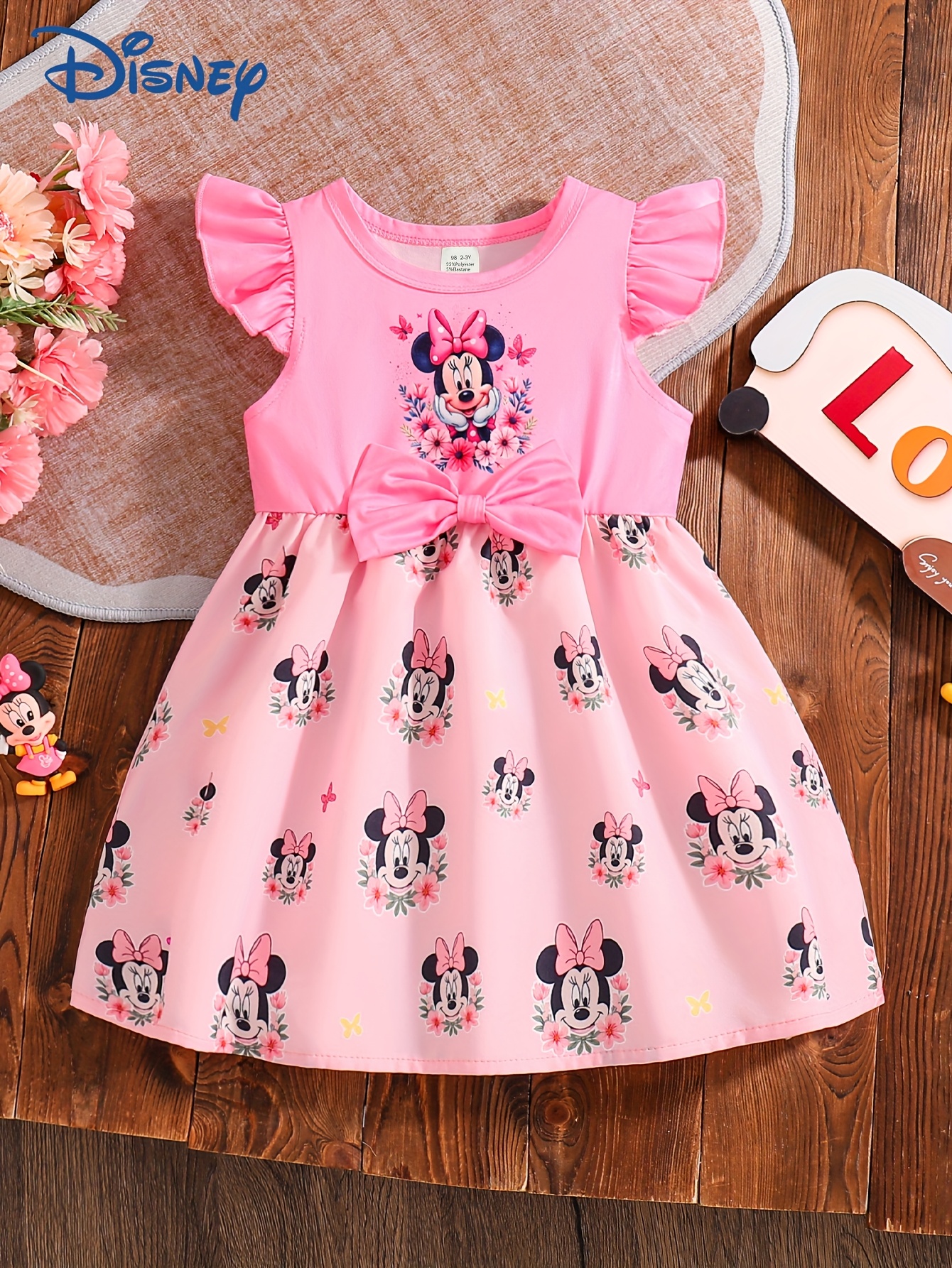 Minnie Mouse summer dress in a vibrant floral print, perfect for sunny days.
