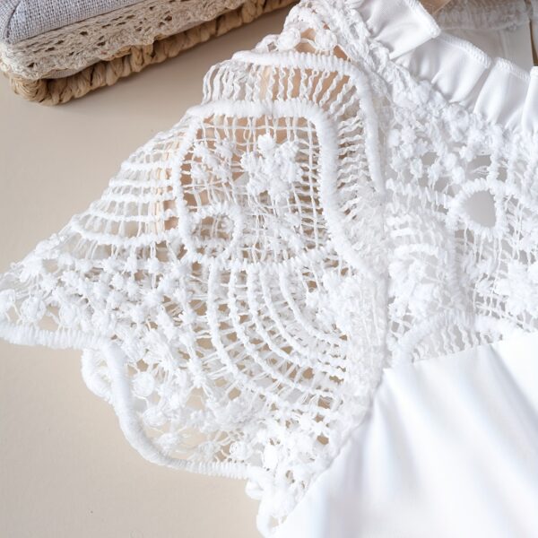 Adorable girl wearing a white Summer Bloom Lace Trim Dress, showcasing its delicate lace details and summery style.
