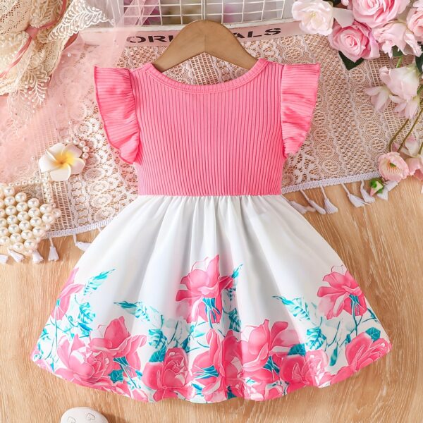 A little girl wearing a charming summer floral print dress.