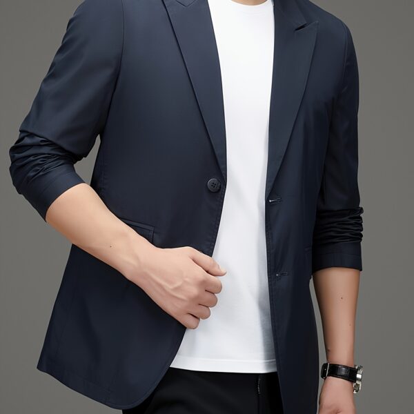 Newness Metropolitan Men's Casual Suit Jacket in versatile navy blue, modeled on a man striding confidently through a city street. The jacket is shown to highlight its sophisticated style and comfortable fit, perfect for spring or autumn.