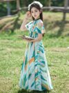 Adorable girl twirling in a flowy elegant chiffon dress perfect for summer The dress is in a beautiful summer garden setting