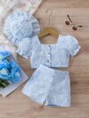 Adorable baby girl wearing a Summer Bloom floral outfit perfect for summer The outfit features a delightful floral pattern