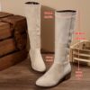 Newness Effortless Chic Winter Mid Calf Boots Stylish brown leather boots that reach mid calf perfect for any occasion The boots are shown from the side highlighting their sleek design and comfortable fit