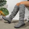 Newness Slouchy Knee High Boots in brown leather showcasing a chic and casual style perfect for winter The boots are slouchy and knee high highlighting their comfortable and fashionable design