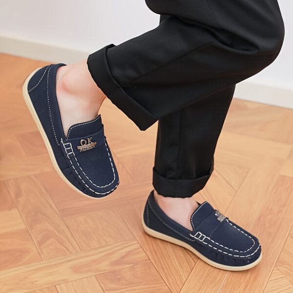 Stylish and comfortable Newness Classic Boys' Loafers, perfect for any occasion. A close-up shot showcasing the loafers' design and quality.