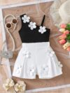 Adorable Summer Bloom floral shorts set in a vibrant print perfect for outdoor play Model is wearing the matching shorts and top