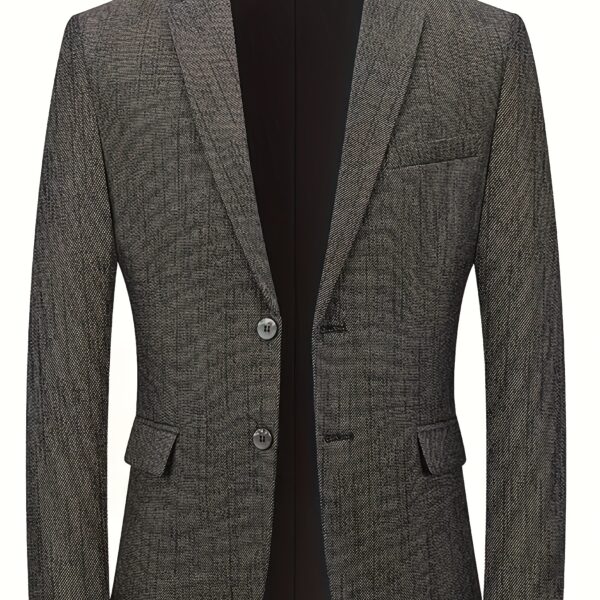 The Newness Metropolitan Slim Fit Blazer in navy blue, shown on a male model. The blazer is a slim fit and features notched lapels, button closure, and welt pockets. The model is wearing a crisp white shirt underneath. The image showcases the versatility of the blazer, suitable for both smart casual and business attire.