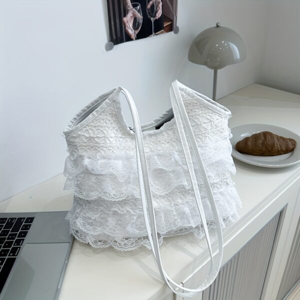 Newness Casablanca Lace Tote Bag: A stunning white lace tote bag, perfect for everyday use or travel. Showcases intricate lace detailing and roomy interior.