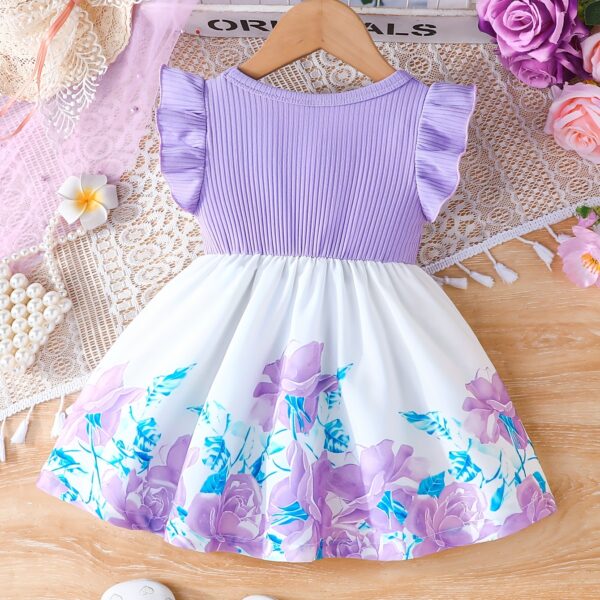 A little girl wearing a charming summer floral print dress.