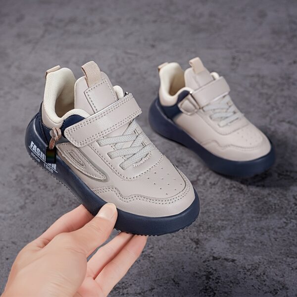 Stylish boy's retro sneakers in white with colorful tassels, perfect for everyday wear.