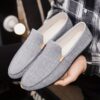 Newness Metropolitan Mens Slip On Loafers in classic black featuring breathable fabric a durable PU sole and stylish golden accents Perfect for everyday wear