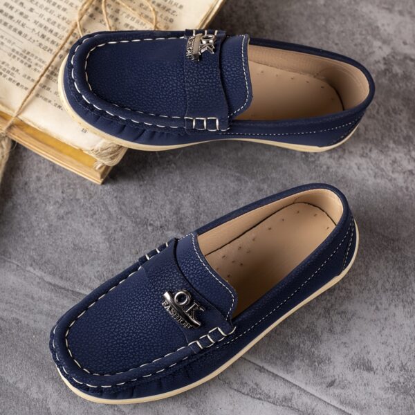 Stylish and comfortable Newness Classic Boys' Loafers, perfect for any occasion. A close-up shot showcasing the loafers' design and quality.