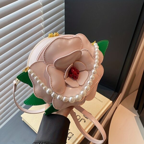 Camellia Blossom Floral Shoulder Bag from Newness, featuring a unique floral design, pearl accents, and an adjustable strap.