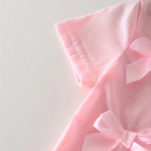 Adorable girls denim set with sweetheart neckline and bow detail, perfect for playdates or school.