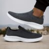 Newness Urban Trek Mens Slip On Sneakers in stylish minimalist design showcasing breathable comfort and effortless style