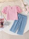 Adorable toddler girl in a stylish summer outfit featuring a cute bow Shop Newness for more childrens fashion