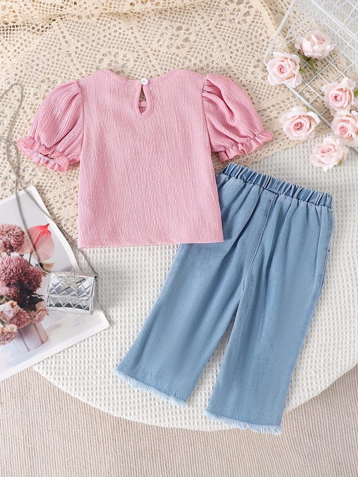 Adorable toddler girl in a stylish summer outfit featuring a cute bow Shop Newness for more childrens fashion