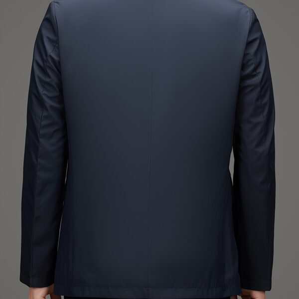 Newness Metropolitan Men's Casual Suit Jacket in versatile navy blue, modeled on a man striding confidently through a city street. The jacket is shown to highlight its sophisticated style and comfortable fit, perfect for spring or autumn.