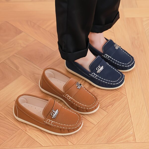 Stylish and comfortable Newness Classic Boys' Loafers, perfect for any occasion. A close-up shot showcasing the loafers' design and quality.