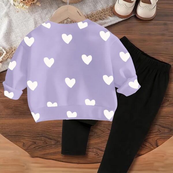 Adorable girls' playful set featuring a sweet heart print, perfect for fall and winter. The outfit includes [mention pieces included, e.g., a sweater and leggings] in soft, comfortable fabrics.