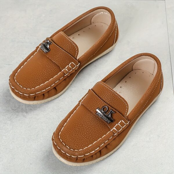 Stylish and comfortable Newness Classic Boys' Loafers, perfect for any occasion. A close-up shot showcasing the loafers' design and quality.
